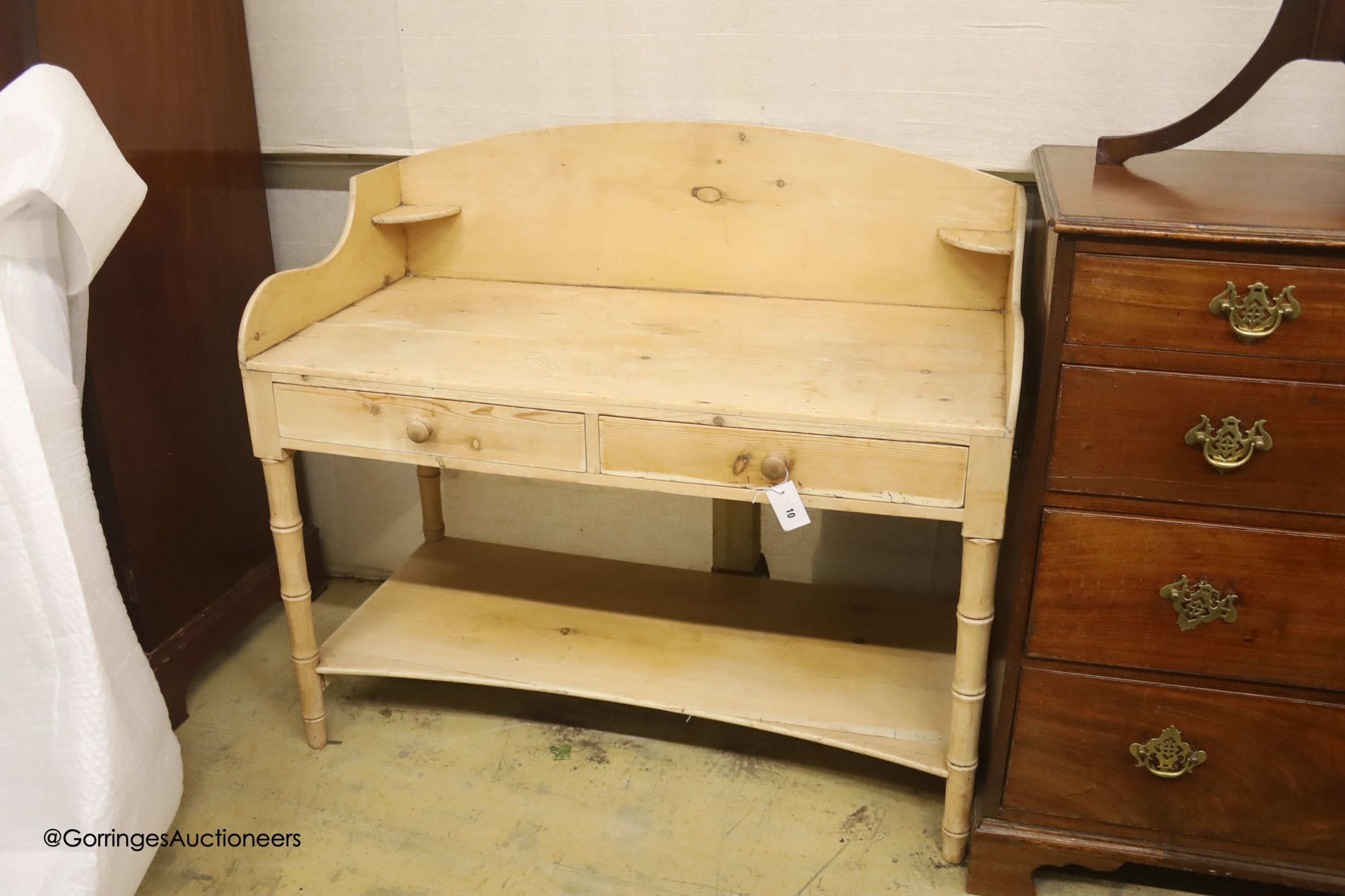 An early 19th century pine two tier washstand, width 105cm, depth 50cm, height 93cm